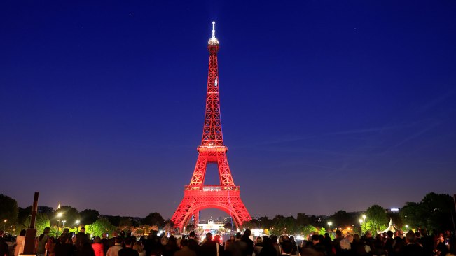 The Eiffel tower is illuminated during a light show to celebrate its 130th anniversary in Paris